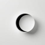 A minimalist and modern design composition where a single, impactful visual element (e.g., a logo, an icon, or a simplified product outline) is centrally placed and surrounded by expansive, serene negative space. The abundant blank space amplifies focus, creates clarity, and conveys a sense of professional elegance and sophistication. The background should be a subtle, harmonious tone, not necessarily white, allowing the negative space to breathe.