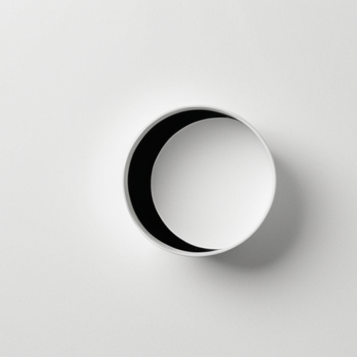 Home 7 A minimalist and modern design composition where a single, impactful visual element (e.g., a logo, an icon, or a simplified product outline) is centrally placed and surrounded by expansive, serene negative space. The abundant blank space amplifies focus, creates clarity, and conveys a sense of professional elegance and sophistication. The background should be a subtle, harmonious tone, not necessarily white, allowing the negative space to breathe.